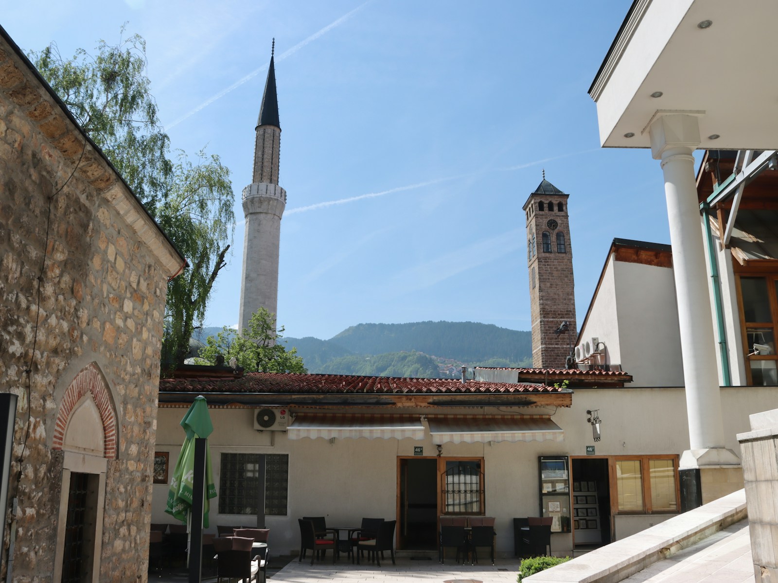 a building with a clock tower in the background